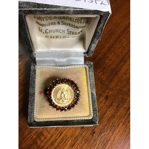 33 - Size M 9ct Gold ring set Garnets with 22 ct gold Mexican coin in the centre - BOX FOR DISPLAY ONLY