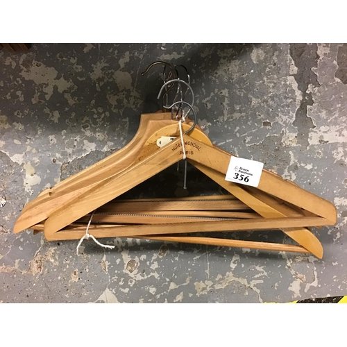 356 - 7 x Vintage wooden coat hangers inc Hotel Mondial Of Paris etc