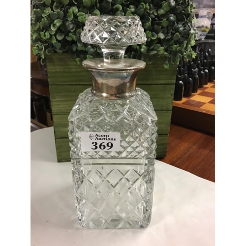 369 - Glass decanter with hallmarked silver collar