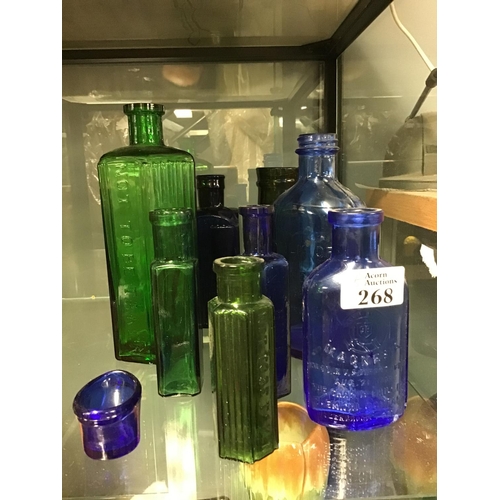 268 - 8 x Green and blue early glass bottles & 1 x Vintage eye bath