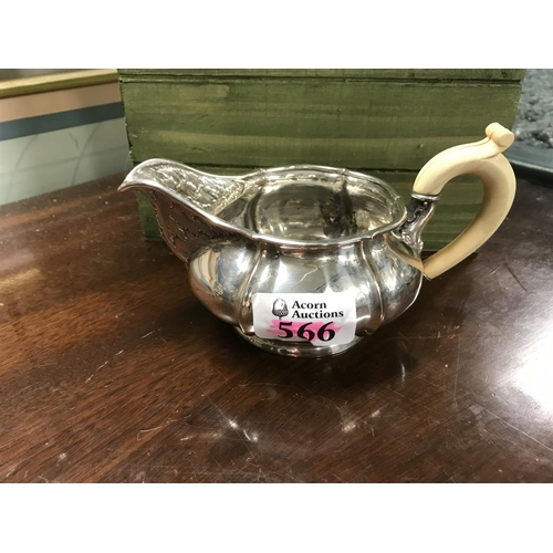 566 - Lovely milk jug marked Solid Silver