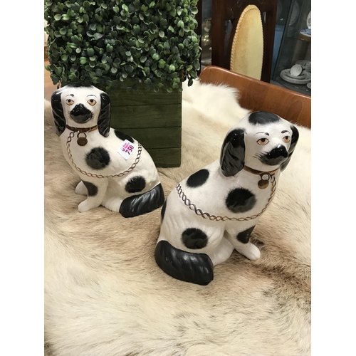 750 - Pair of Staffordshire fire dogs