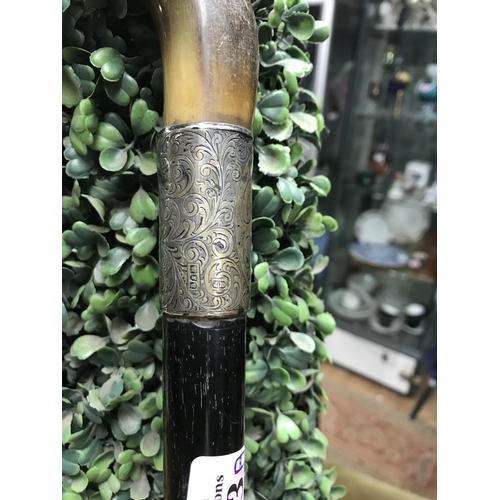 793A - Gents early walking stick with hrn handle and ornate unmarked silver collar