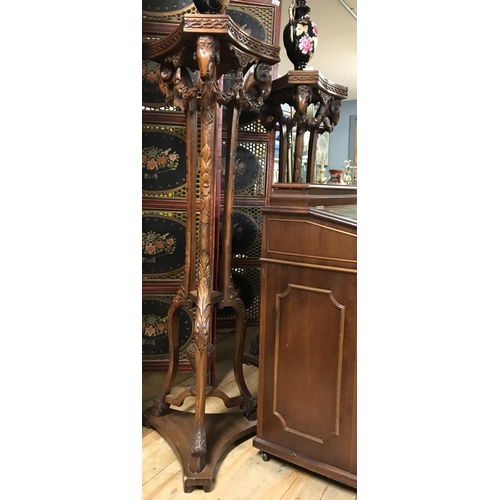 842 - Stunning pair of early tall decorative plant stands. Decorated with Rams heads and hoofed feet. Appr... 