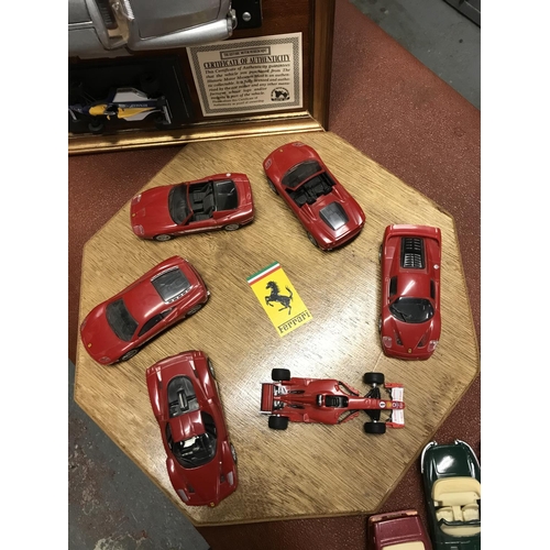 198 - Collection of assorted model cars inc Ferrari models displayed on a board