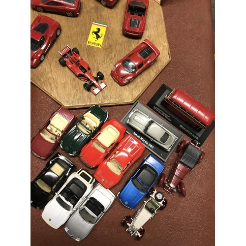 198 - Collection of assorted model cars inc Ferrari models displayed on a board