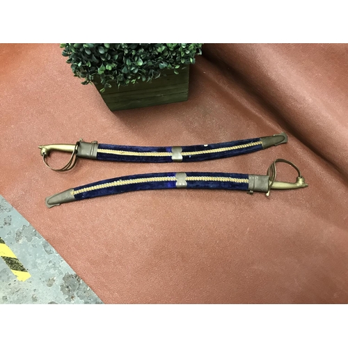 662 - Pair of small decorative dress swords in velvet scabbards