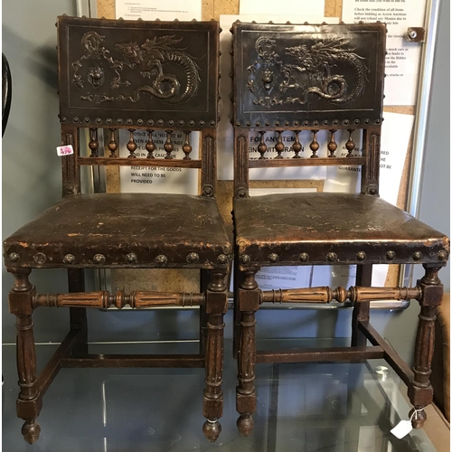 975C - Pair of stunning early chairs with original leather seat and backs decorated with beautiful Dragons ... 