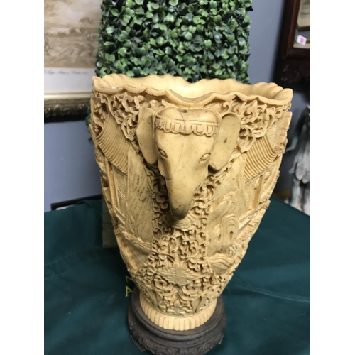 269 - Very ornate vase with elephant head handles and ornate carvings to front & back - on a base