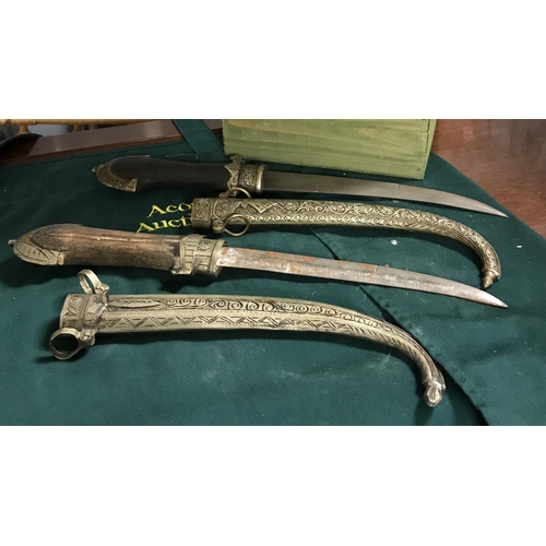 449 - 2 x Decorative Arabic daggers in metal sheaths...