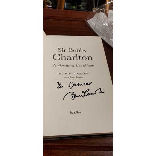 79 - Hard backed Autographed Bobby Charlton book 