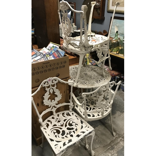 316 - WHITE METAL ORNATE GARDEN TABLE & 4 X CHAIRS