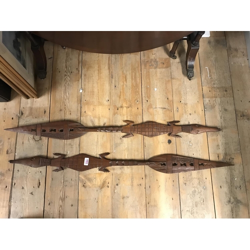 849 - PAIR OF ORNATE CARVED WOODEN SPEARS / PADDLES  IN THE FORM OF ALIGATORS