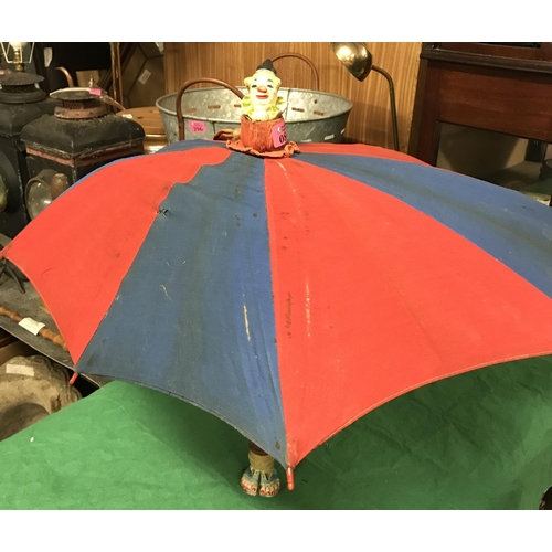 81 - VINTAGE CHILDS UMBRELLA WITH CLOWNS HEAD TOP AND CLOWN FEET AT BASE