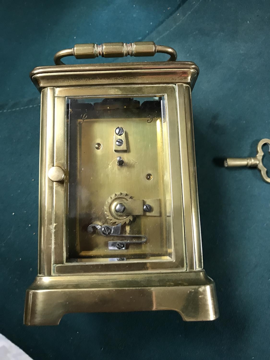 SMALL CARRIAGE CLOCK WITH KEY SLIGHT A/F TO SIDE GLASS CLOCKS AND