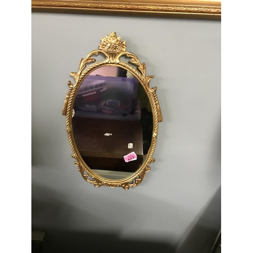 613 - GILT METAL FRAMED MIRROR 50CMS X 28CMS