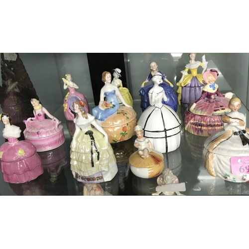 696 - 12 X VINTAGE POWDER POTS IN THE FORM OF CRINOLINE LADIES - AVERAGE HEIGHT 10CMS