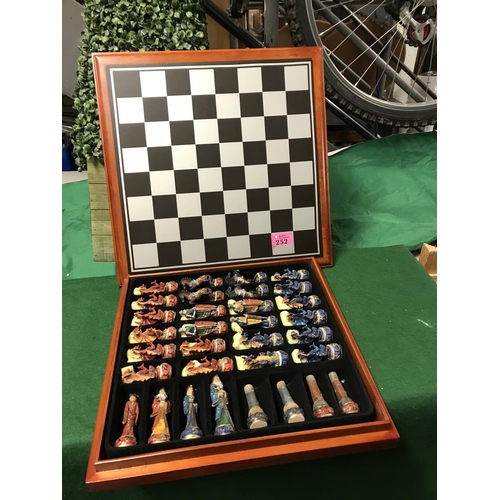 252 - BOXED CHESS SET WITH DECORATIVE DRAGON & KNIGHTS ETC CHESS PEICES