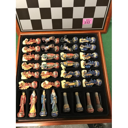 252 - BOXED CHESS SET WITH DECORATIVE DRAGON & KNIGHTS ETC CHESS PEICES