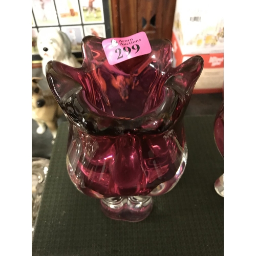 299 - 2 X HEAVY RED GLASS VASES - 23CMS H & 20CMS H