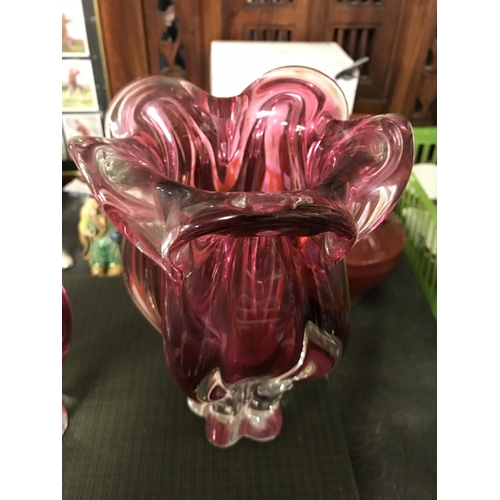 299 - 2 X HEAVY RED GLASS VASES - 23CMS H & 20CMS H