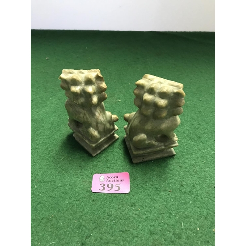 395 - PAIR OF NATURAL STONE CARVED ORIENTAL DOGS OF FOE - SMALL CHIP TO BASE - 9CMS H