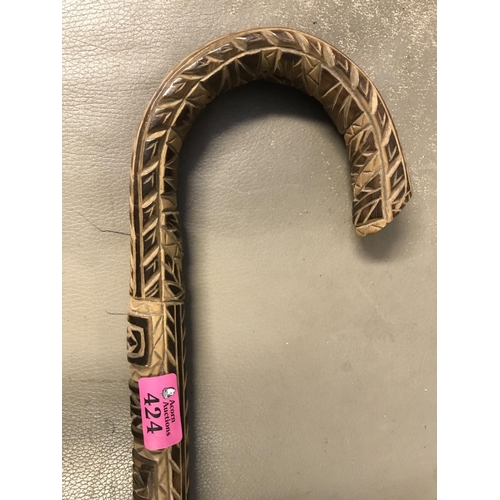 424 - HEAVILY CARVED TRIBAL STYLE WALKING STICK