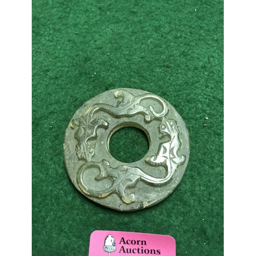 475 - ORIENTAL CIRCULAR CARVING - POSSIBLY JADE DEPICTING A DRAGON - 7CMS