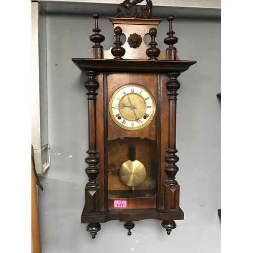 143 - EARLY HEAVILY CARVED WALL CLOCK WITH ENAMEL & BRASS FACE - 36CMS X 80CMS - CLOCKS AND WATCHES ARE NO... 