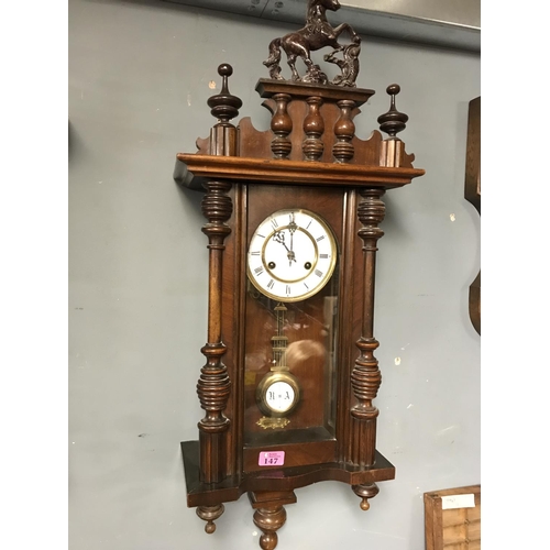 147 - EARLY WALL CLOCK WITH HEAVILY CARVED DETAILING AND BRASS & ENAMEL FACE - 36CMS X 80CMS - WATCHES & C... 