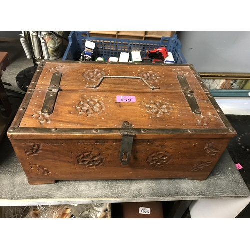 153 - UNUSUAL CARVED WOODEN BOX WITH METAL STRAPPING - 38CMS X 25CMS X 16CMS H