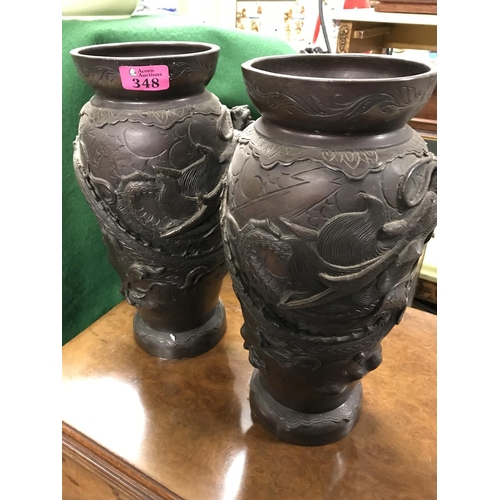 348 - PAIR OF EARLY ORIENTAL BRONZE VASES DECORATED WITH DRAGONS - 34CMS H