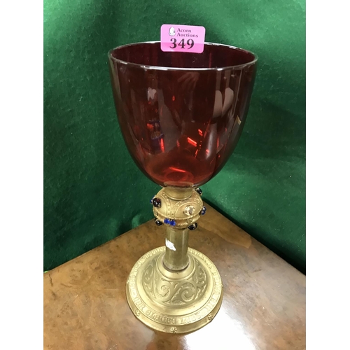 349 - UNUSUAL RED GLASS & GILT JEWELLED METAL GOBLET - 27CMS H