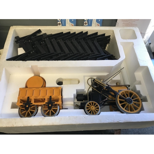 379 - BOXED 1980 150TH ANNIVERSARY STEPHENSONS ROCKET TRAIN WITH COACH BY  HORNBY & ACCESSORIES -