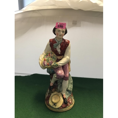 380 - UNUSUAL LARGE EARLY STAFFORDSHIRE FIGURE OF A YOUNG MAN WITH BASKET OF VEGETABLES - 34CMS H