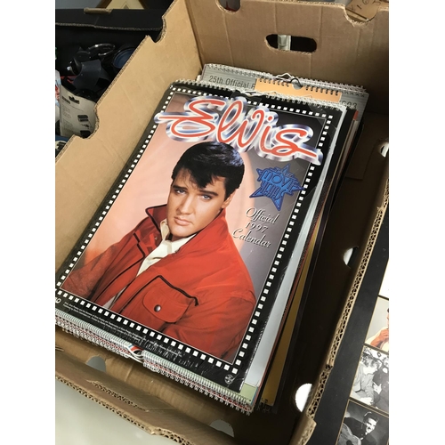 LARGE BOX OF ELVIS CALENDARS & ELVIS MONTHLY PAPER BOOKS & TIN SIGN