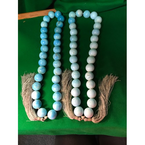 82 - 2 X SUN WASHED BLUE HEAVY NATURAL STONE BEADS WITH JUTE TASSELS - EACH BEAD IS APPROX 3CMS & LENGTH ... 