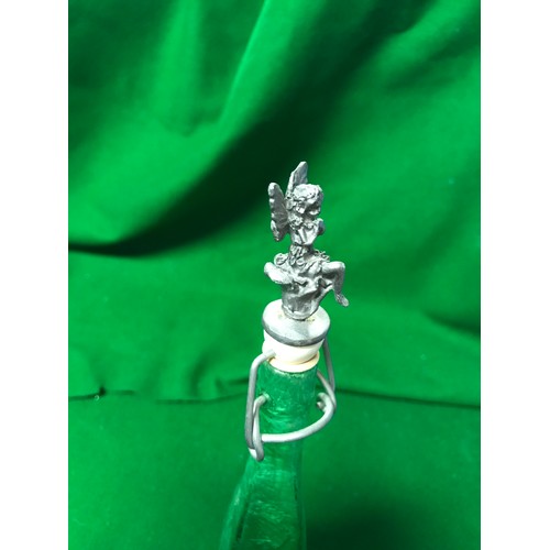 562 - UNUSUAL GREEN GLASS BOTTLE WITH METAL FAIRY TOP - 25CMS H