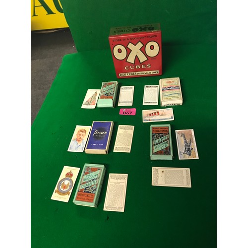 67 - VINTAGE OXO CUBE TIN WITH 9 X PACKETS OF WOODBINE & JOHN PLAYER  VINTAGE CIGARETTE CARDS - NOT CHECK... 