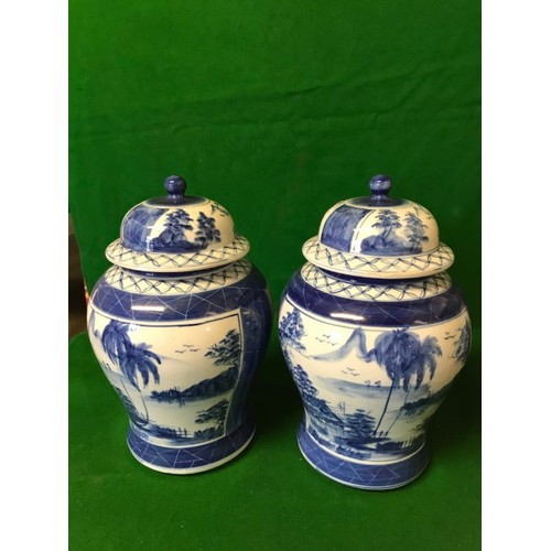 397 - PAIR OF BLUE AND WHITE LIDDED GINGER JARS - 30CMS H