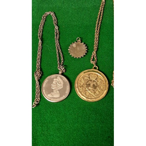 130 - 2 X COMMEMORATIVE COINS MOUNTED AS PENDANTS ON CHAIN & 1 X 3d COIN