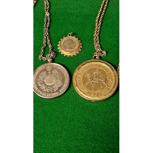 130 - 2 X COMMEMORATIVE COINS MOUNTED AS PENDANTS ON CHAIN & 1 X 3d COIN