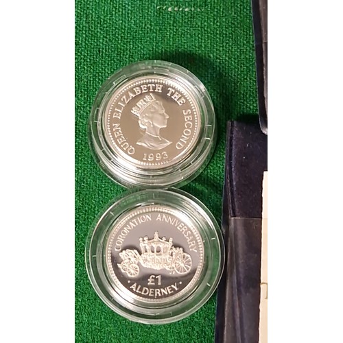 135 - 2 X CASED ALDERNEY CORONATION ANNIVERSARY £1 COINS WITH CERTS