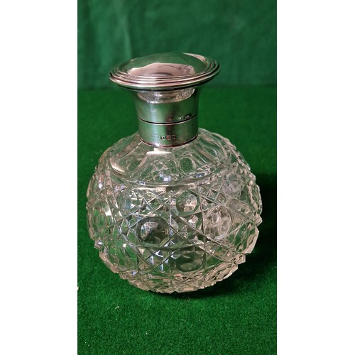 261 - LARGE CUT GLASS SCENT BOTTLE WITH HALLMARKED SILVER TOP AND NECK - 13CMS H