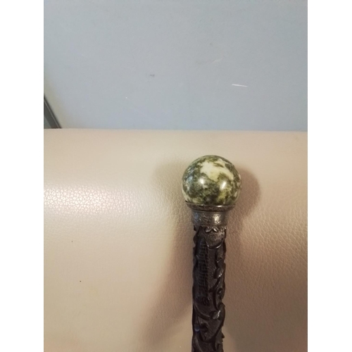 370 - VINTAGE WALKING CANE WITH CARVED DETAIL TO END AND MARBLE TOP - 80CMS L