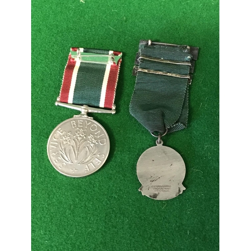 691 - EARLY DRIVING MEDAL & WOMANS VOLUNTEER MEDAL