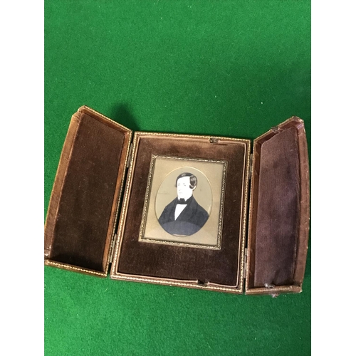 726 - EARLY PAINTED WATERCOLOUR MINIATURE OF A MAN IN A LEATHER CASE - CLOSED 12CMS X 10CMS