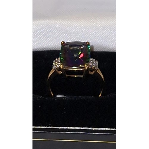 83 - 9CT GOLD MYSTIC TOPAZ RING