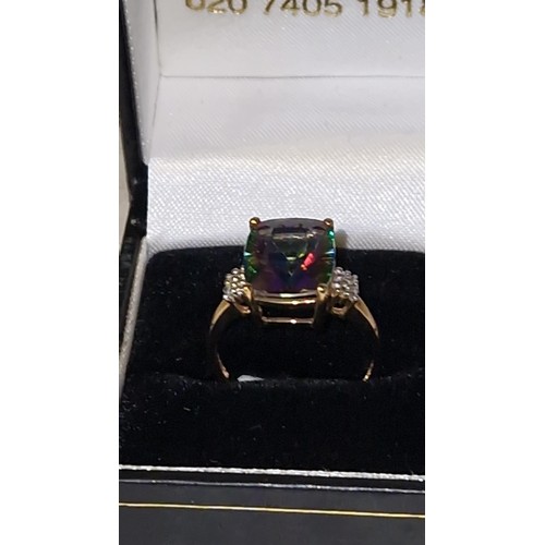 83 - 9CT GOLD MYSTIC TOPAZ RING