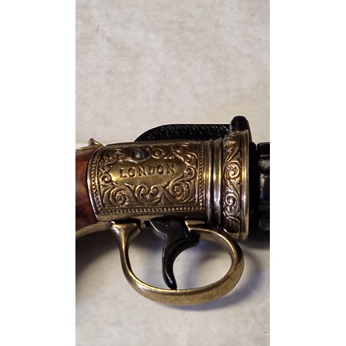 194 - DECORATIVE REPRODUCTION 6 BARREL PISTOL